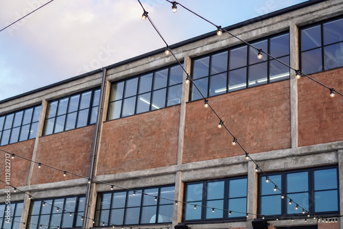 Historic Noblessner building in Tallinn illuminated by string lights in 2024