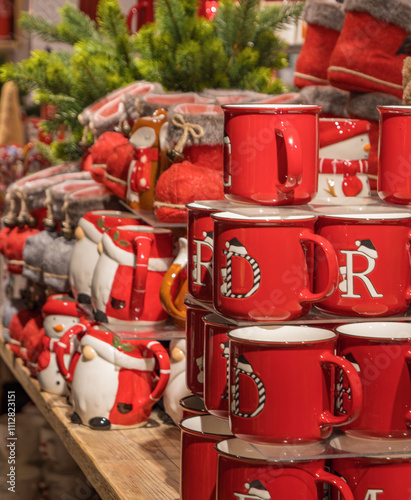 Christmas souvenirs - red cups with letters are sold in the Nanu-Nana shop. A large assortment of products for the traditional holiday of Christmas.