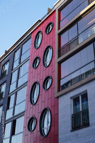 Modern architecture in Noblessner district showcasing unique oval windows in Tallinn, Estonia, 2024 photo