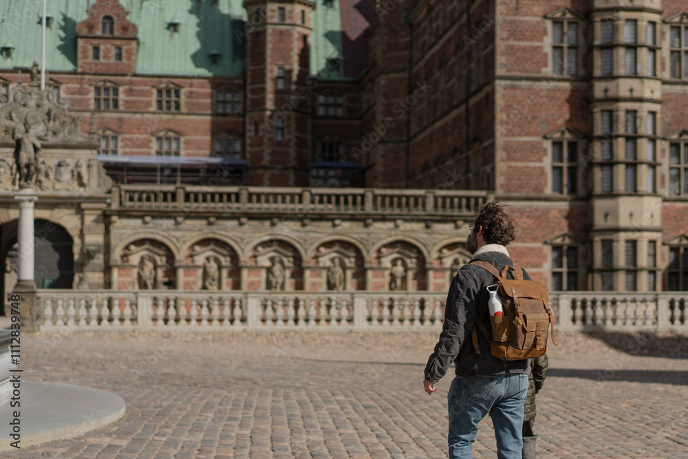 Visitor exploring Frederiksborg Castle in Denmark
Visitor exploring Frederiksborg Castle in Denmark