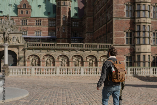 Visitor exploring Frederiksborg Castle in Denmark
 photo