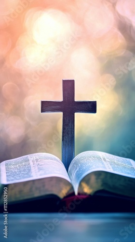 Reflection on faith with an open Bible and a wooden cross in soft natural light