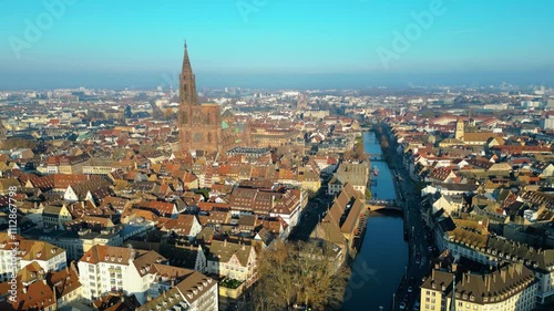 Strasbourg, the capital of Christmas, sparkles during Advent, with its stunning decorations and festive ambiance. This aerial view features the majestic Strasbourg Cathedral, La Petite France 