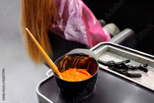 Hair Coloring Tools with Orange Dye in Modern Salon Setting