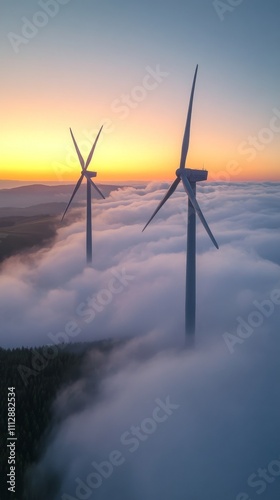 Wind turbines rising above the clouds during sunrise in a serene landscape
