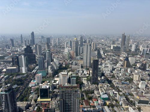 A cityscape with tall buildings and a clear blue sky photo