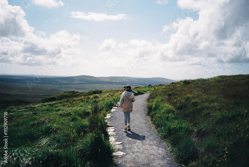 A girl hiking in the mountains photo