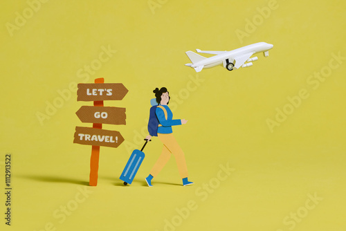 Traveler With Suitcase And Sign Saying Let's Go Travel photo