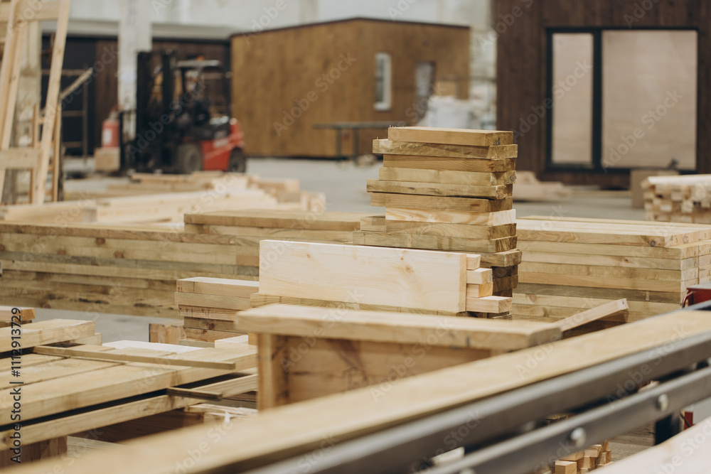 Wooden planks stacked in workshop for modular building construction Wooden planks stacked in workshop for modular building construction