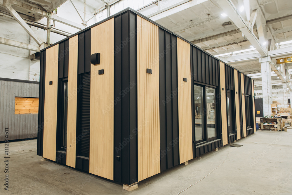 Modern modular house under construction in a factory Modern modular house under construction in a factory