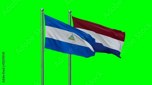 Netherlands and Nicaragua flags flying together, video concept of the relationship with colored chroma key for easy background remove photo