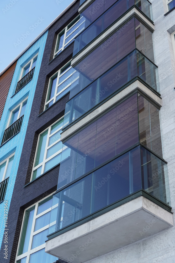 Modern residential architecture in Tallinn's Noblessner area showcases unique glass balconies in 2024 Modern residential architecture in Tallinn's Noblessner area showcases unique glass balconies in 2024