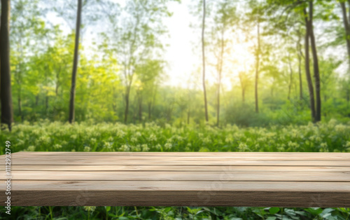 Selective focus.End grain wood counter top with cutting board on blur greeny flower garden in morning with nature light
