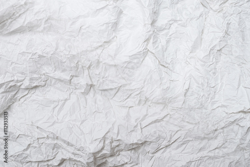 Crumpled white paper background.