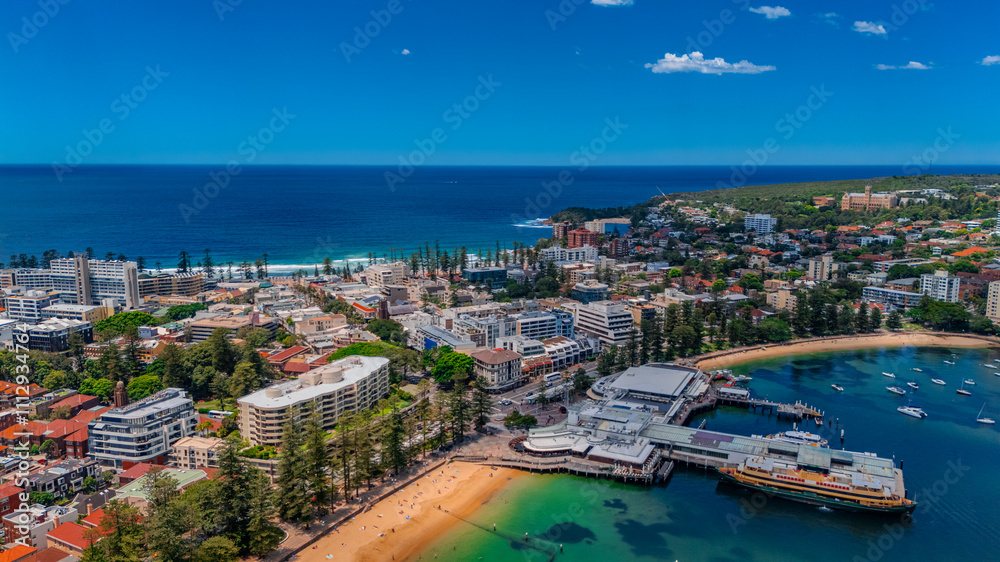 Fototapeta premium Aerial View of Manly Beach and Sydney harbour with manly houses on a warm summer day blue skies Sydney NSW Australia