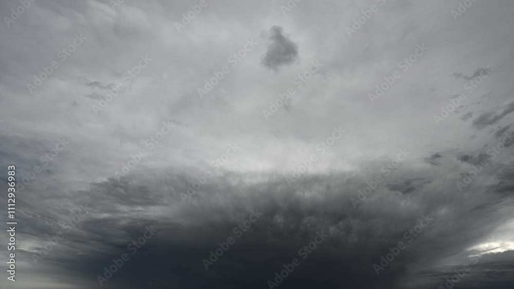 Time lapse of dramatic gray storm clouds moving towards the viewer fill the sky
Time lapse of dramatic gray storm clouds moving towards the viewer fill the sky