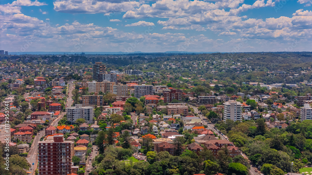Naklejka premium Aerial View of Manly Beach and Sydney harbour with manly houses on a warm summer day blue skies Sydney NSW Australia