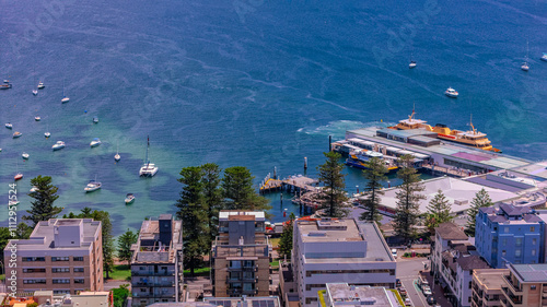 Aerial View of Manly Beach and Sydney harbour with manly houses on a warm summer day blue skies Sydney NSW Australia photo