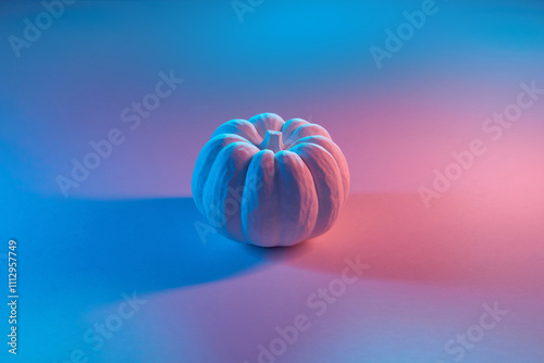 Artificial pumpkin with minimalistic design standing at studio photo