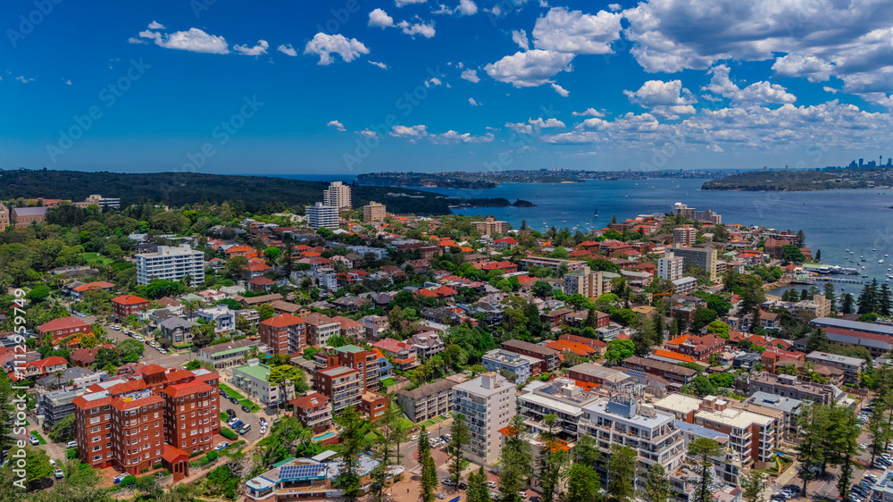 Aerial View of Manly Beach and Sydney harbour with manly houses on a warm summer day blue skies Sydney NSW Australia Aerial View of Manly Beach and Sydney harbour with manly houses on a warm summer day blue skies Sydney NSW Australia