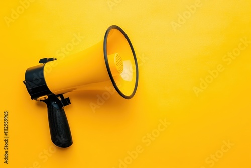 Bright yellow megaphone resting on a vibrant yellow background for effective communication