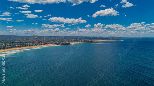 Aerial View of Manly Beach and Sydney harbour with manly houses on a warm summer day blue skies Sydney NSW Australia