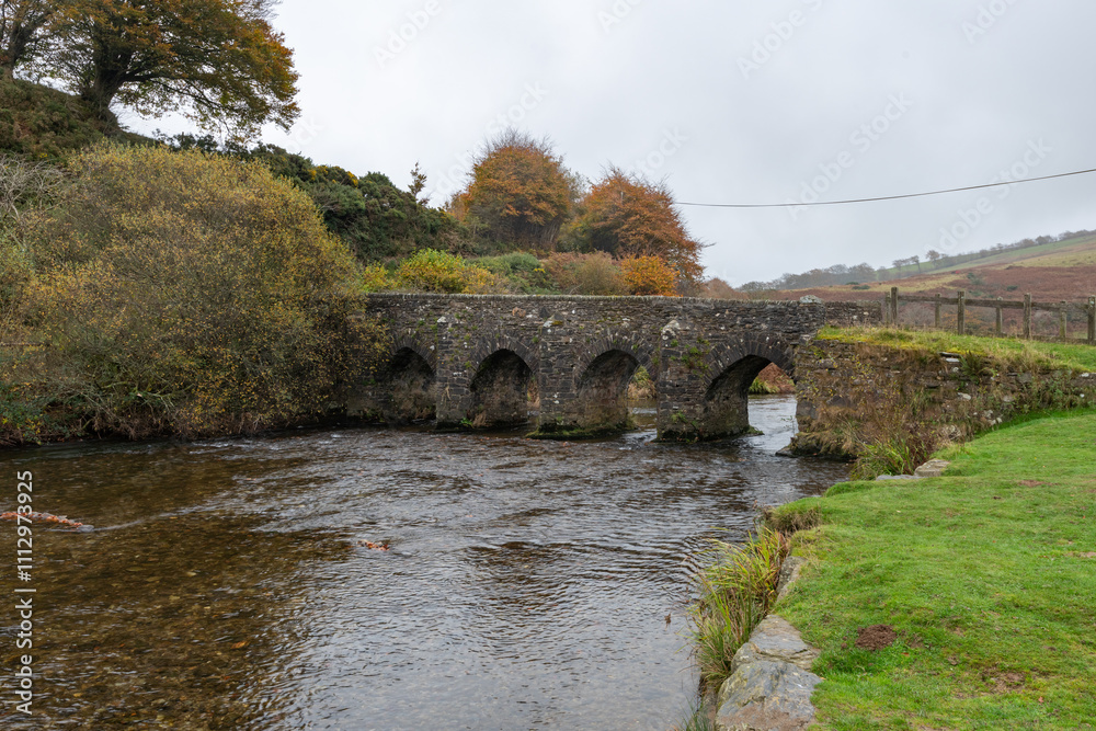Fototapeta premium The autumn colours at Landacre bridge in Exmoor national Park