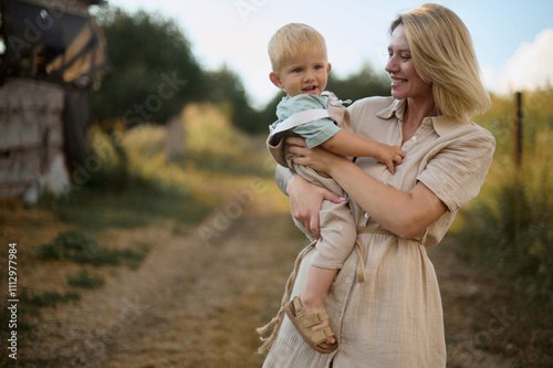 portrait of young blonde mom with her little boy  photo