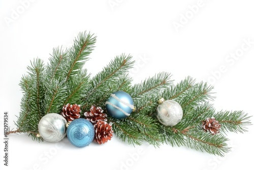 A decorative branch from a Christmas tree adorned with blue and silver ornaments