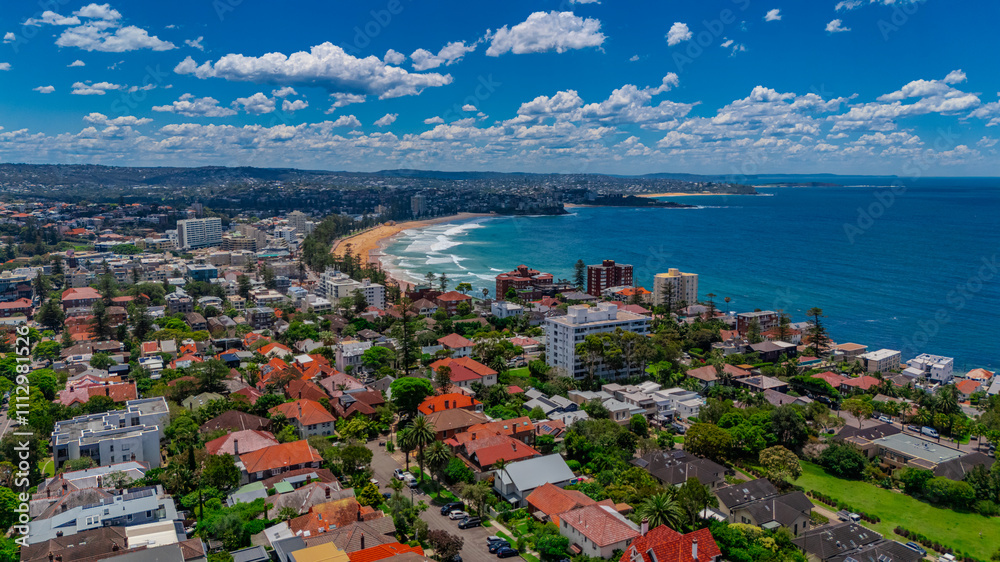 Aerial View of Manly Beach and Sydney harbour with manly houses on a warm summer day blue skies Sydney NSW Australia Aerial View of Manly Beach and Sydney harbour with manly houses on a warm summer day blue skies Sydney NSW Australia