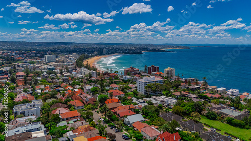 Aerial View of Manly Beach and Sydney harbour with manly houses on a warm summer day blue skies Sydney NSW Australia