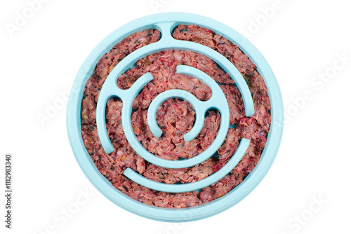Natural raw dog food in slow feeding bowl Slow feeder for dog Top view Close-up 