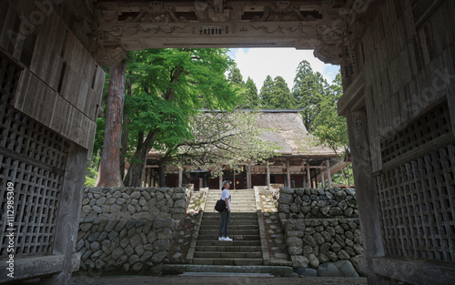 A Man Visiting an Ancient Temple in Japan. photo