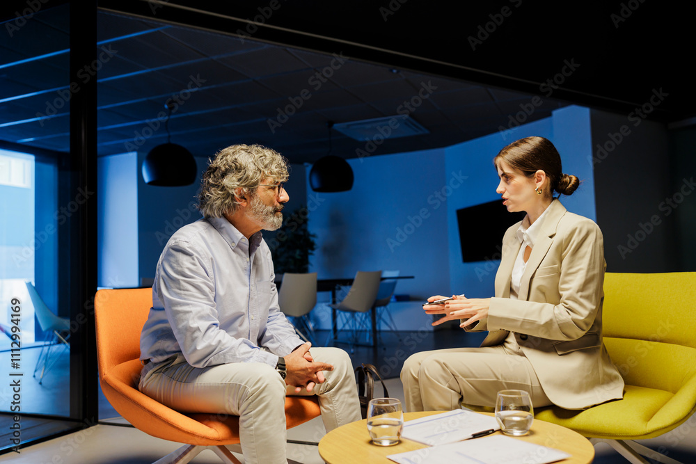 © BONNINSTUDIO/Stocksy - Financial advisors discussing strategy in office at late evening © BONNINSTUDIO/Stocksy - Financial advisors discussing strategy in office at late evening
