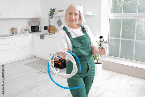 Mature female plumber with ...