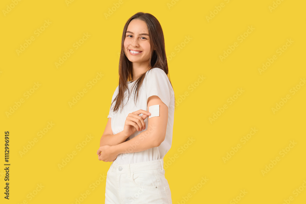 Young woman with applied contraceptive patch on yellow background Young woman with applied contraceptive patch on yellow background