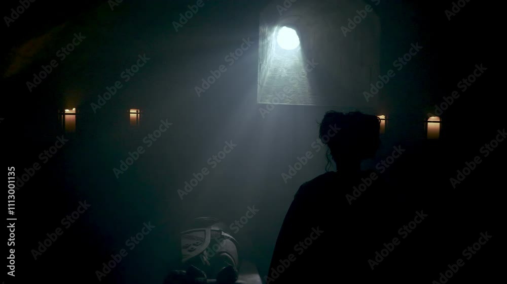 Female Silhouette Looking From Window Inside House. Silhouette of an isolated woman looking to the full moon through a big window inside a house. Jail