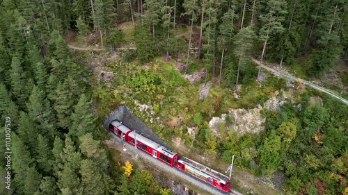 Aerial panorama of Swiss red train on famous Landwasser Viaduct , Graubunden, Switzerland.