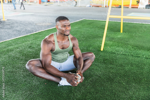 Man Stretching in Outdoor Gym photo