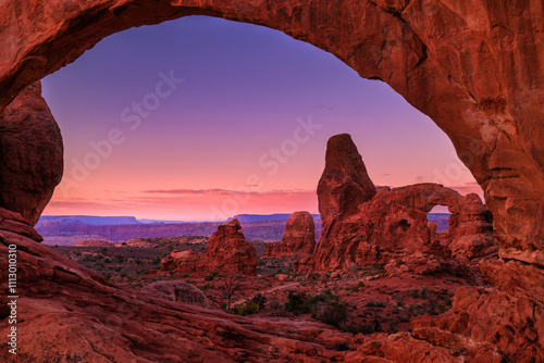 A sunrise  view of turret arch through the north window in arches photo