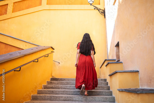 Asian woman climbing stairs in the city photo