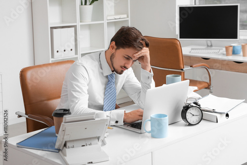 Stressed businessman workin...