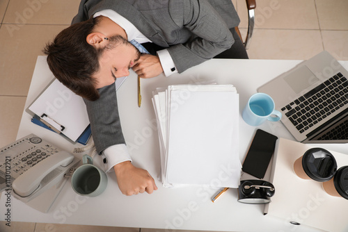 Stressed businessman sleepi...