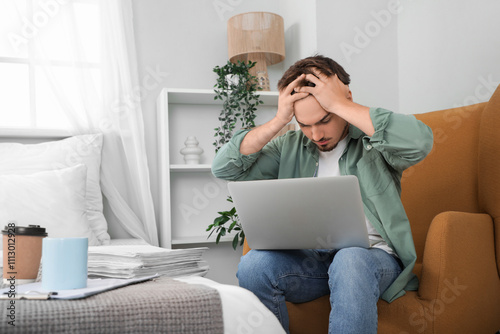 Stressed young man working ...