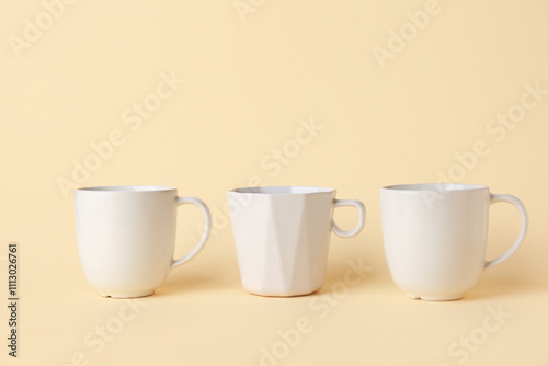 White ceramic empty mugs on...