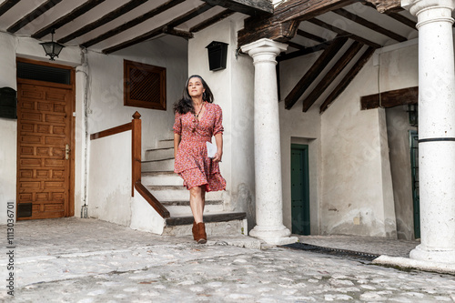 Female tourist in rustic courtyard photo