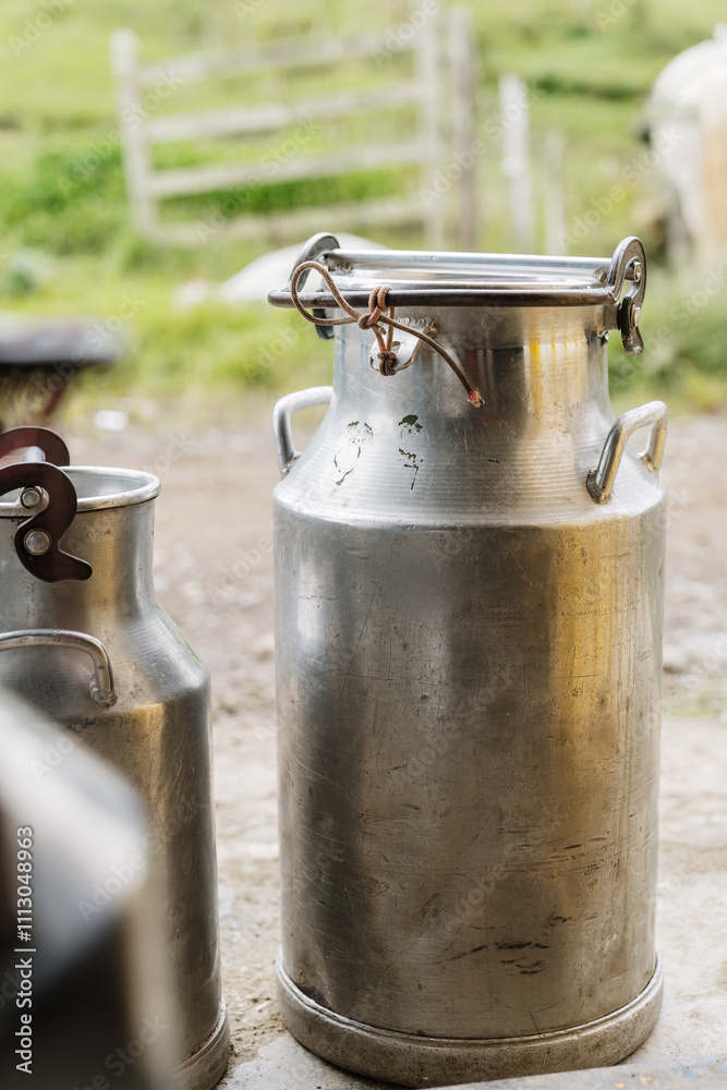 Large milk can standing on a farm Large milk can standing on a farm