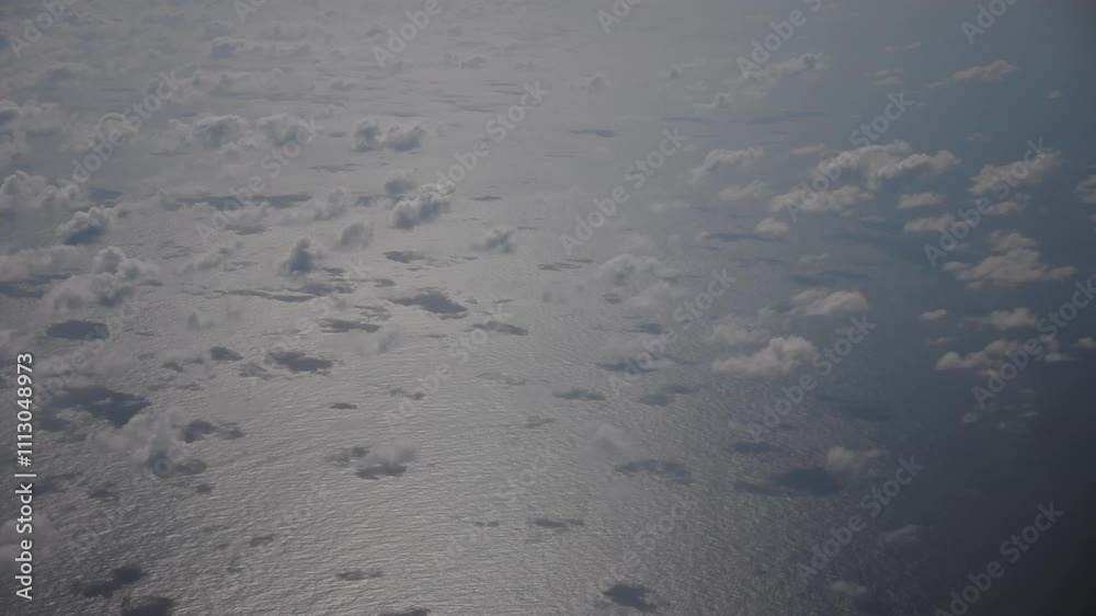 AERIAL SHOT FROM PLAN. VIEW OF THE ISLAND WITH CLOUDS FROM THE PLANE AERIAL SHOT FROM PLAN. VIEW OF THE ISLAND WITH CLOUDS FROM THE PLANE