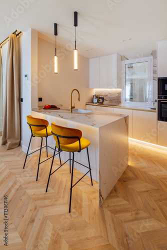 Modern kitchen interior with marble island and yellow stools