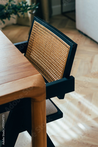 Modern Wooden Dining Chair with Woven Backrest in Sunlit Room photo